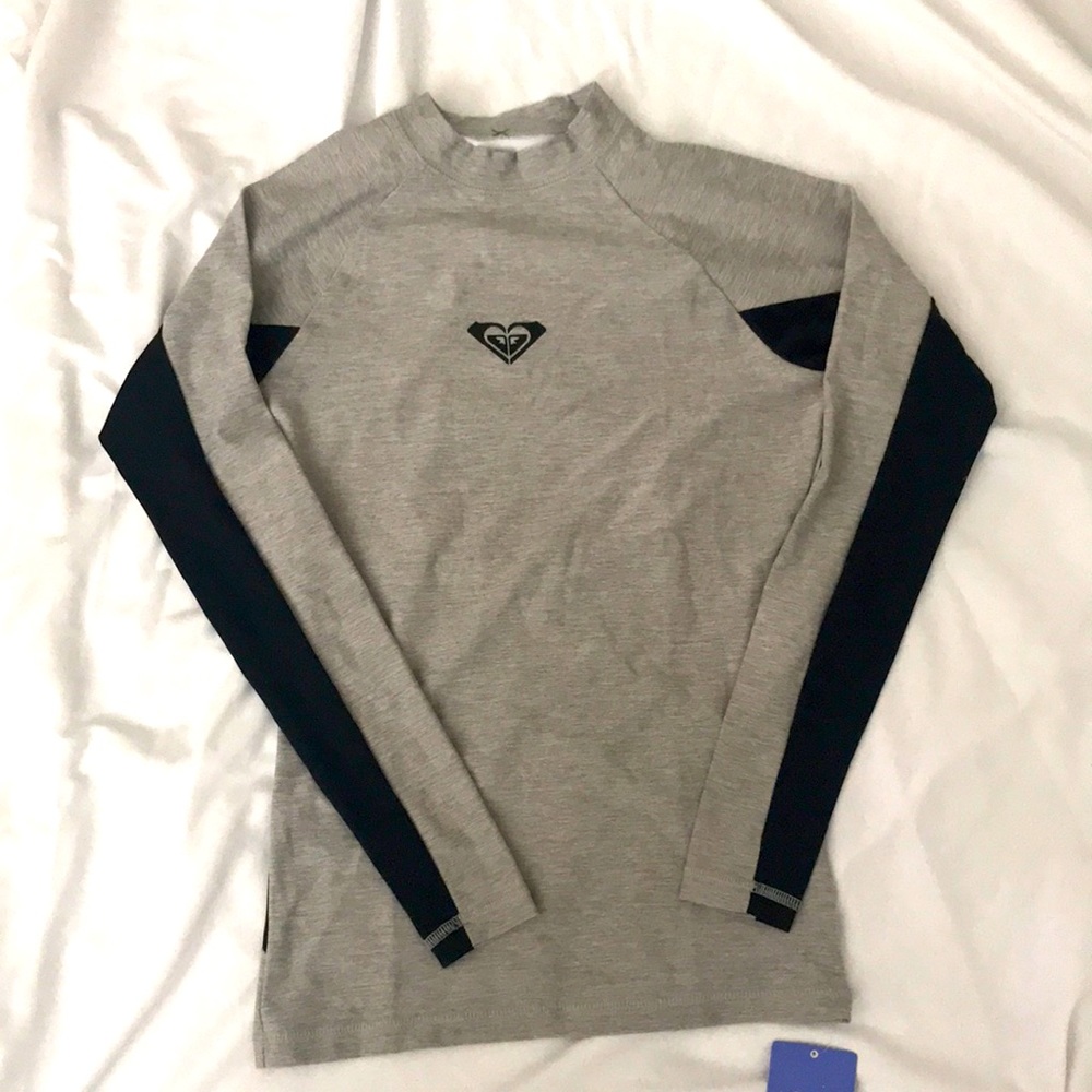 Brand new, never been worn-  Roxy rash guard